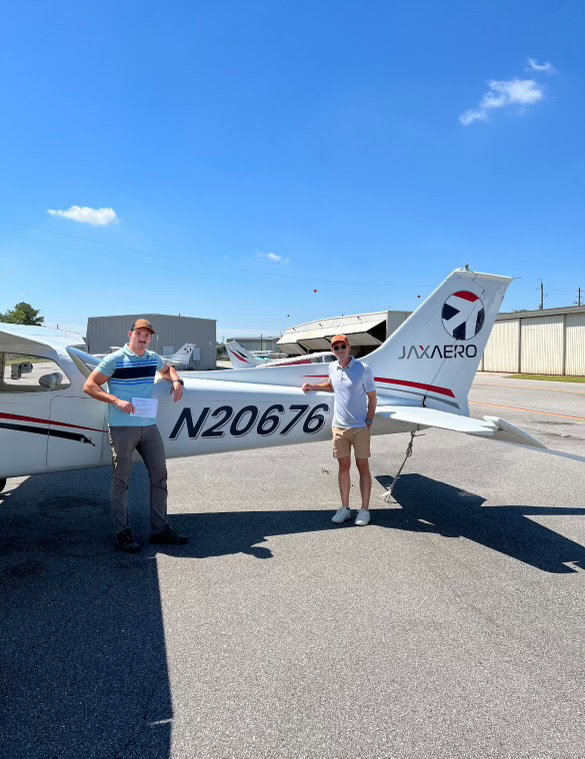 Woman smiling outside of plane