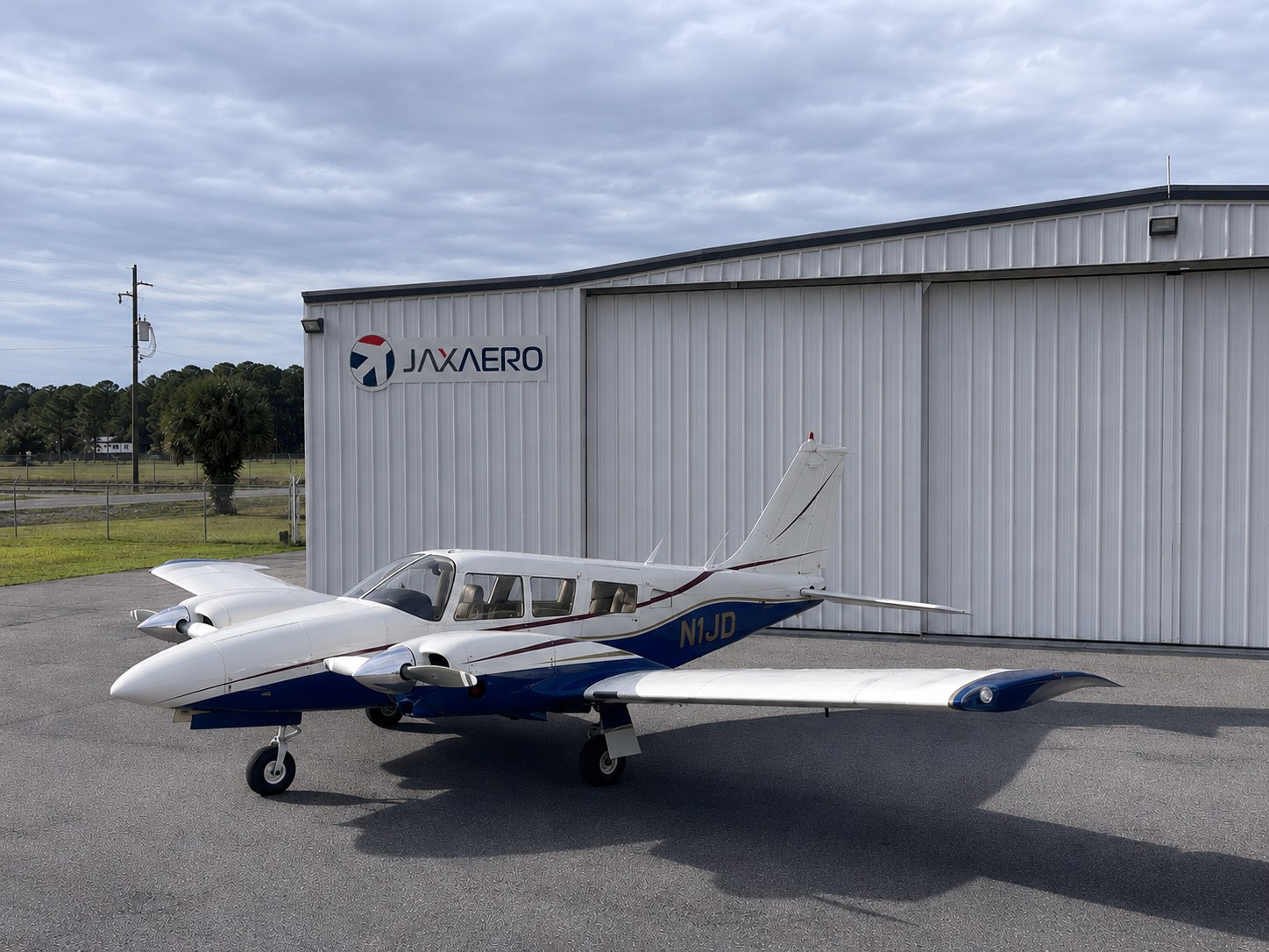 JAXAERO Piper Seneca twin-engine trainer N1JD parked in front of the JAXAERO hangar